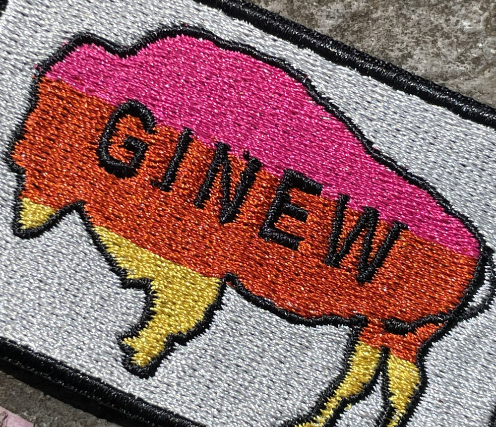 Close up of Indigenous Native American Buffalo Patch with metallic background and pink, orange, yellow buffalo 