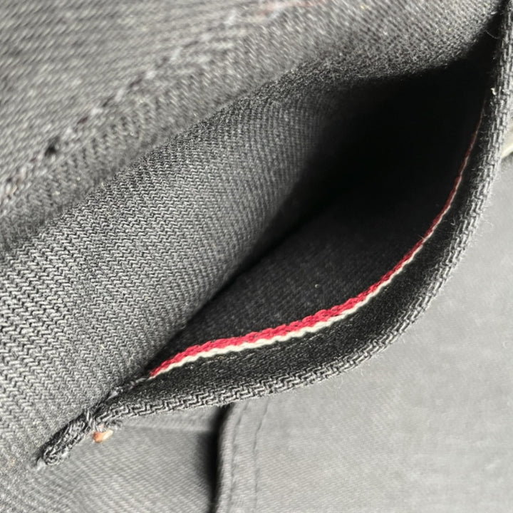 Selvedge coin pocket on Black selvedge denim jeans made in USA with Native American Ginew Leather Patch 